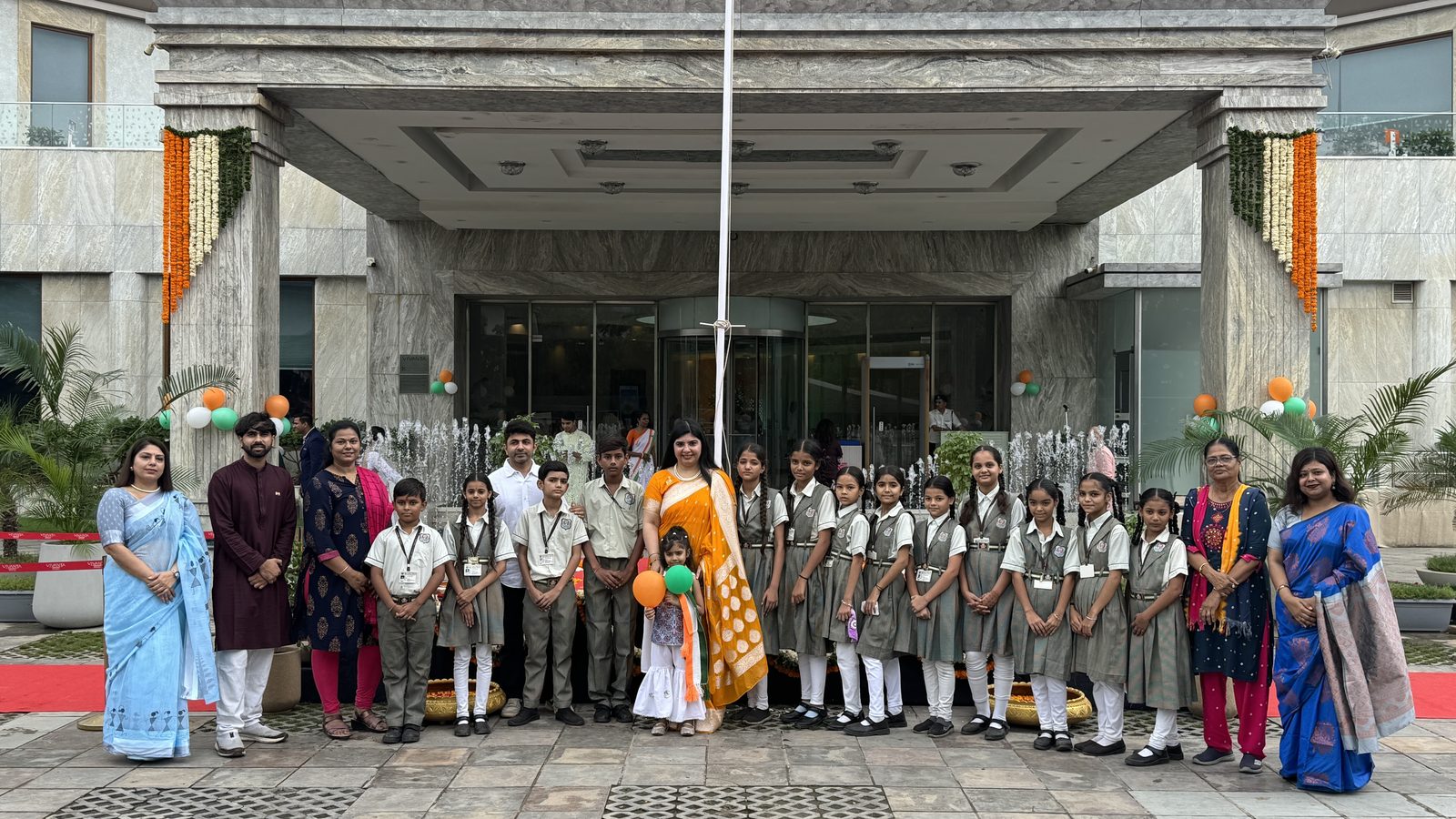 Partner school students and teachers gathered with Social Eye Foundation staff at a flag-hoisting ceremony.