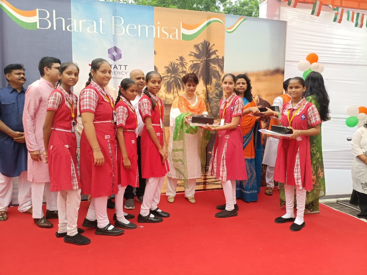Students receiving school supplies at an Aadhaar Shiksha distribution event.
